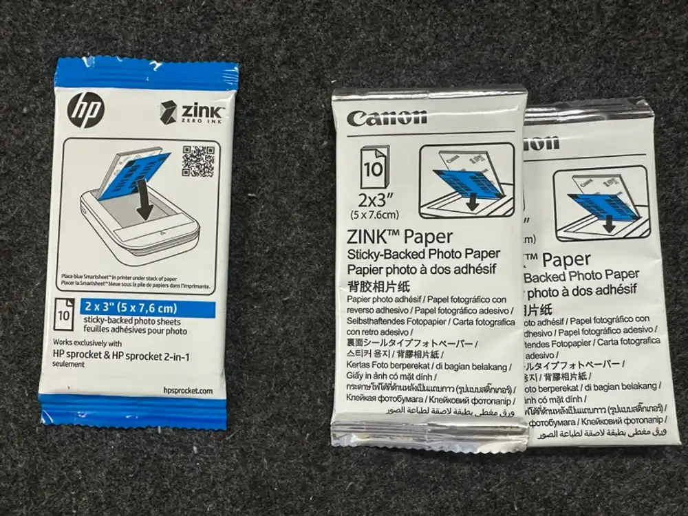HP genuine and Canon ZINK paper packages