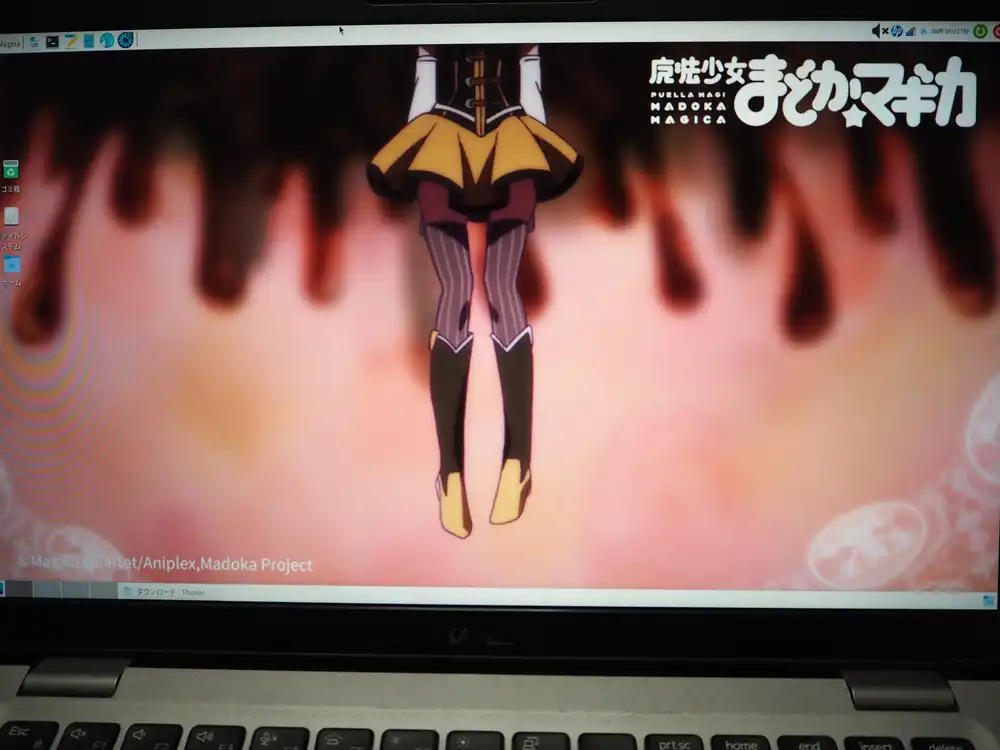 Mageia Xfce desktop with the wallpaper changed to Puella Magi Madoka Magica